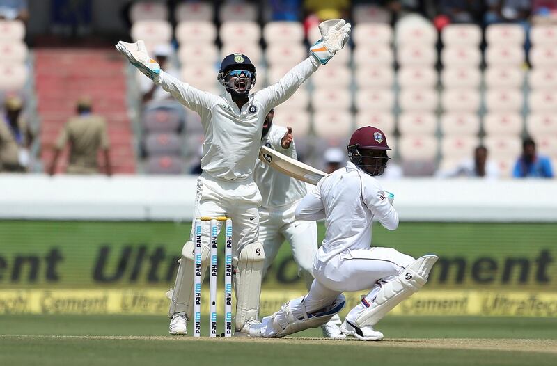 Indian wicketkeeper Rishabh Pant successfully appeals for the dismissal of West Indies' player Shimron Hetmyer, bowled by Kuldeep Yadav, during the first day of the second cricket test match between India and West Indies in Hyderabad, India.