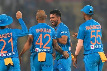 Indian seamer Deepak Chahar, second right, picked up a hat-trick while finishing with world record T20 figures of 6-7 against Bangladesh in Nagpur. AFP