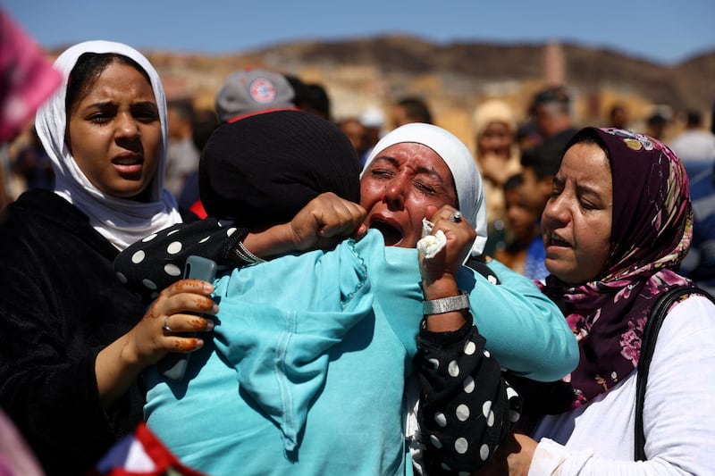 People react during the funeral of two victims of the deadly earthquake, in Moulay Brahim, Morocco. Reuters