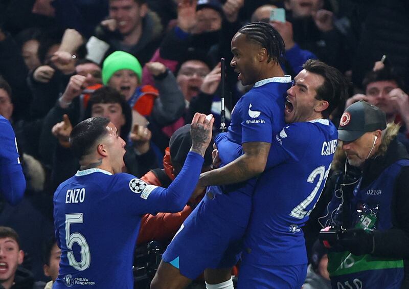 Chelsea's Raheem Sterling celebrates with Enzo Fernandez and Ben Chilwell after scoring their first goal against Borussia Dortmund in the Champions League last-16 second-leg game at Stamford Bridge on Tuesday, March 7, 2023. Reuters