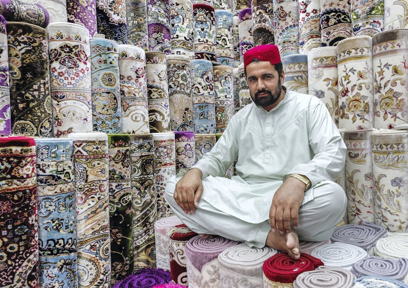 Abu Dhabi, UAE, March 5, 2018.  
Carpet Souk along Mina St. Abu Dhabi.
Noor Mohammed has been working for
Izmir Carpet Trading for 11 years now.  He is from Kabul, Afghanistan.
Victor Besa / The National