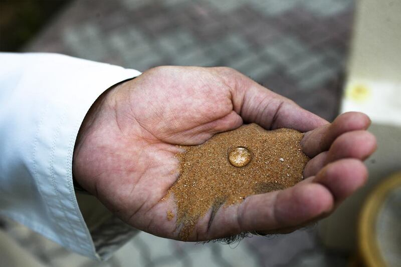 Desalt Innovation Middle East produces waterproof sand, above, which can help with saltwater erosion and the maintenance of groundwater levels and salinity. Lee Hoagland / The National