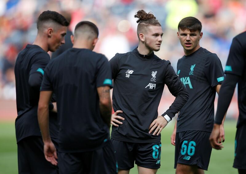 Liverpool completed the signing of 16-year-old winger Harvey Elliott, centre, from Fulham and then manager Jurgen Klopp put him on with 15 minutes to go of their 3-0 friendly defeat against Napoli. Reuters