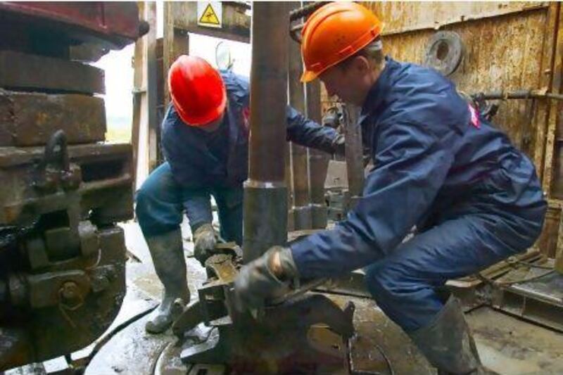 This year emerging economies will consume more oil than high-income countries. Above, workers drill for oil in Russia. Bloomberg News