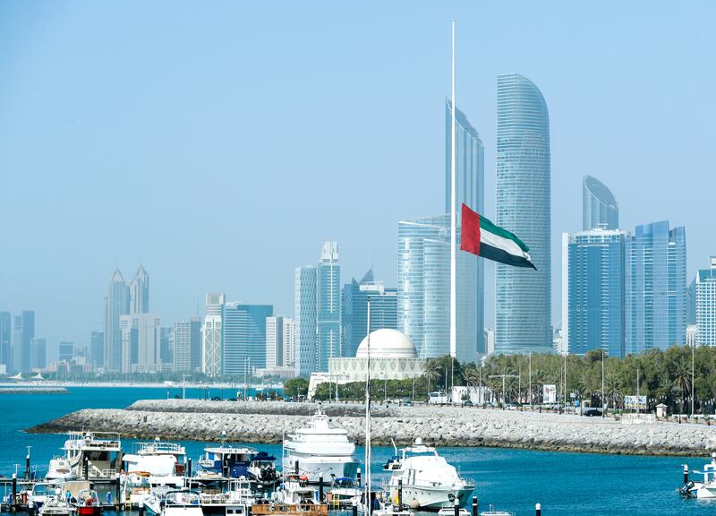 The UAE flag along the Corniche in Abu Dhabi flies at half-mast.  Victor Besa / The National