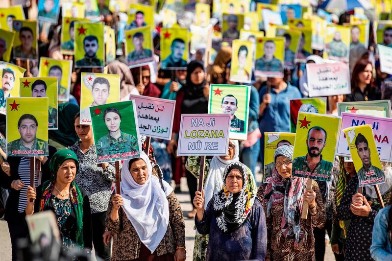 Syrian Kurds demonstrate in front of the United Nations headquarters in the Kurdish-majority city of Qamishli in northeast Syria. AFP