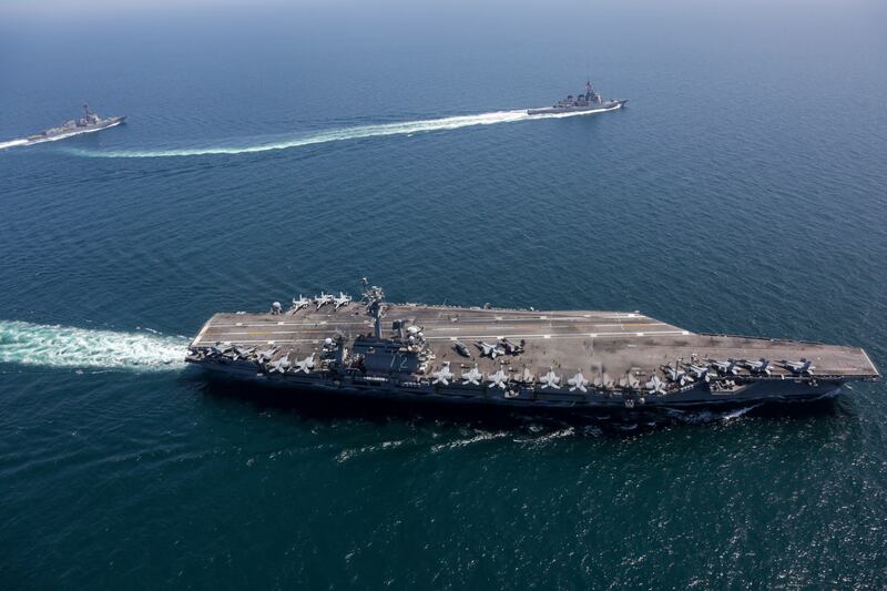 USS Abraham Lincoln, front, and other warships sail in formation during a US-Japan exercise in the Sea of Japan.  AP