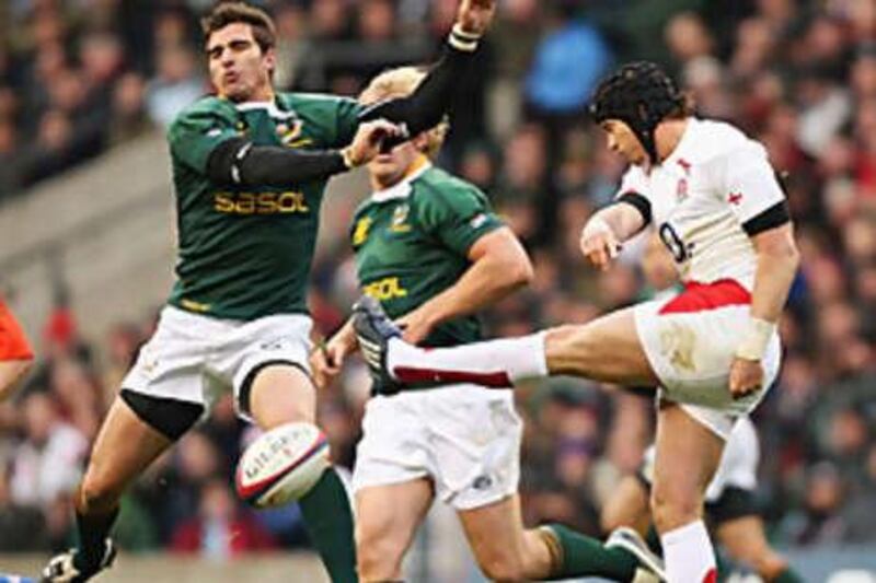 Ruan Pienaar charges down a kick by Danny Cipriani to score South Africa's second try against England.