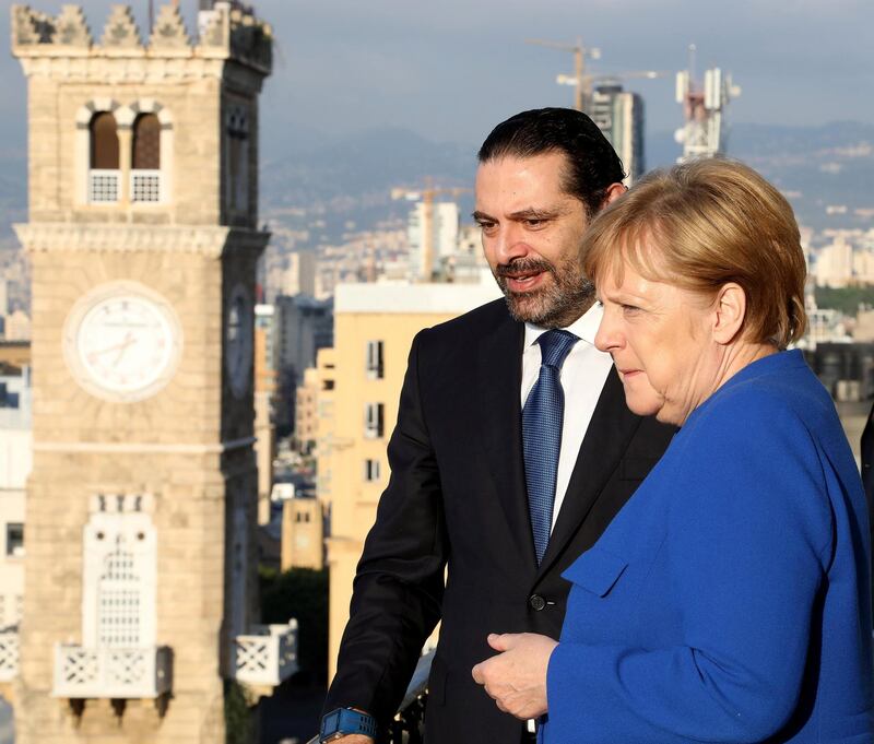 Lebanese Prime Minister-designate Saad al-Hariri stands with German Chancellor Angela Merkel at the government palace in Beirut, Lebanon June 21, 2018. Dalati Nohra/Handout via REUTERS ATTENTION EDITORS - THIS IMAGE WAS PROVIDED BY A THIRD PARTY