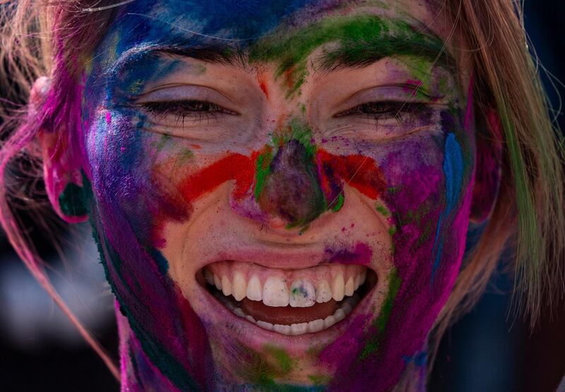 A tourist is covered in colored powder during Holi Festival celebrations in Kathmandu, Nepal, 09 March 2020. Holi, also known as the Festival of Colors, marks the beginning of spring and is celebrated all over Nepal and neighboring India. EPA