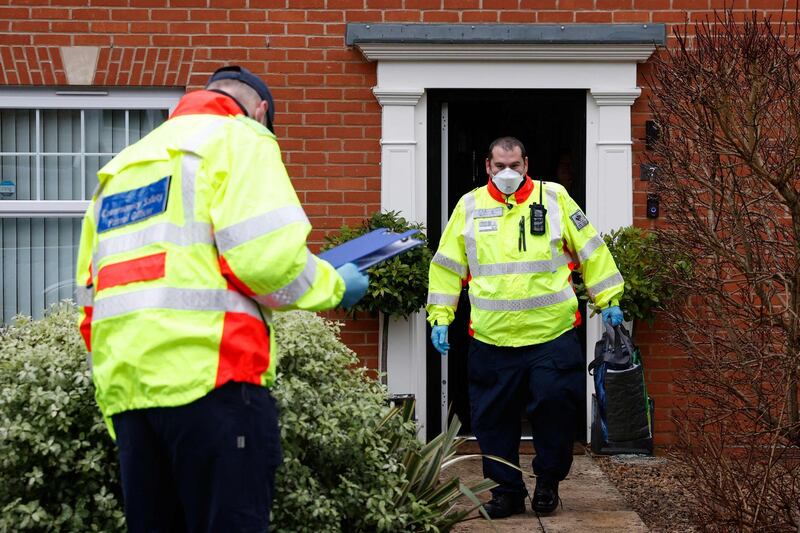 Volunteers distribute coronavirus self-test kits to residents at a home in the village of Bramley, west of London. AFP