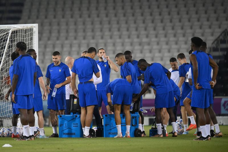 France players stop for a drinks break during a training session. AFP