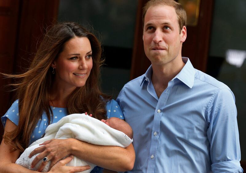 Britain's Prince William and Kate, Duchess of Cambridge pose for photographers with the Prince of Cambridge, Tuesday, July 23, 2013 outside St. Mary's Hospital exclusive Lindo Wing in London where the Duchess gave birth on Monday. Prince William and his wife Kate presented their newborn son to the world for the first time Tuesday, drawing whoops and wild applause from well-wishers as they revealed the new face of the British monarchy - though not, yet, his name. (AP Photo/Lefteris Pitarakis) *** Local Caption ***  Britain Royal Baby.JPEG-0f25c.jpg