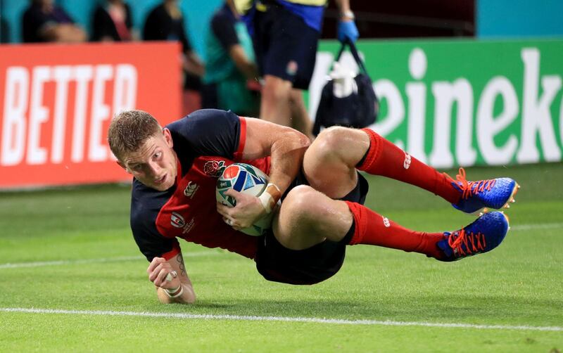 England's Ruaridh McConnochie scores his sides fifth try. Press Association