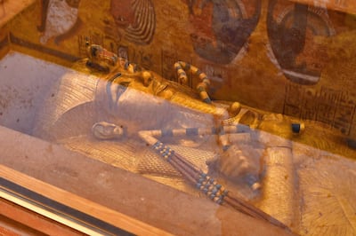 This picture taken on January 31, 2019 shows the golden sarcophagus of the 18th dynasty Pharaoh Tutankhamun (1332–1323 BC), displayed in his burial chamber in his underground tomb (KV62) in the Valley of the Kings on the west bank of the Nile river opposite the southern Egyptian city of Luxor (650 kilometres south of the capital Cairo). - The famous tomb underwent a nine-year conservation by a team of international specialists. (Photo by MOHAMED EL-SHAHED / AFP)
