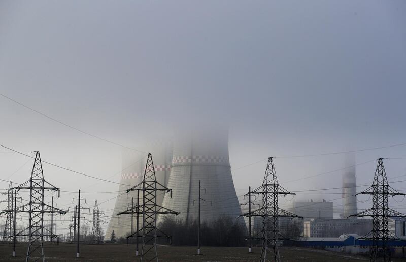 A heating plant is seen in Minsk, Belarus, partially covered by fog. AP