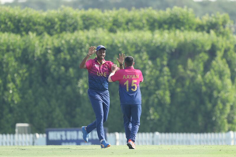 UAE captain Aayan Afzal Khan celebrates after taking the wicket of Jishan Alam of Bangladesh.