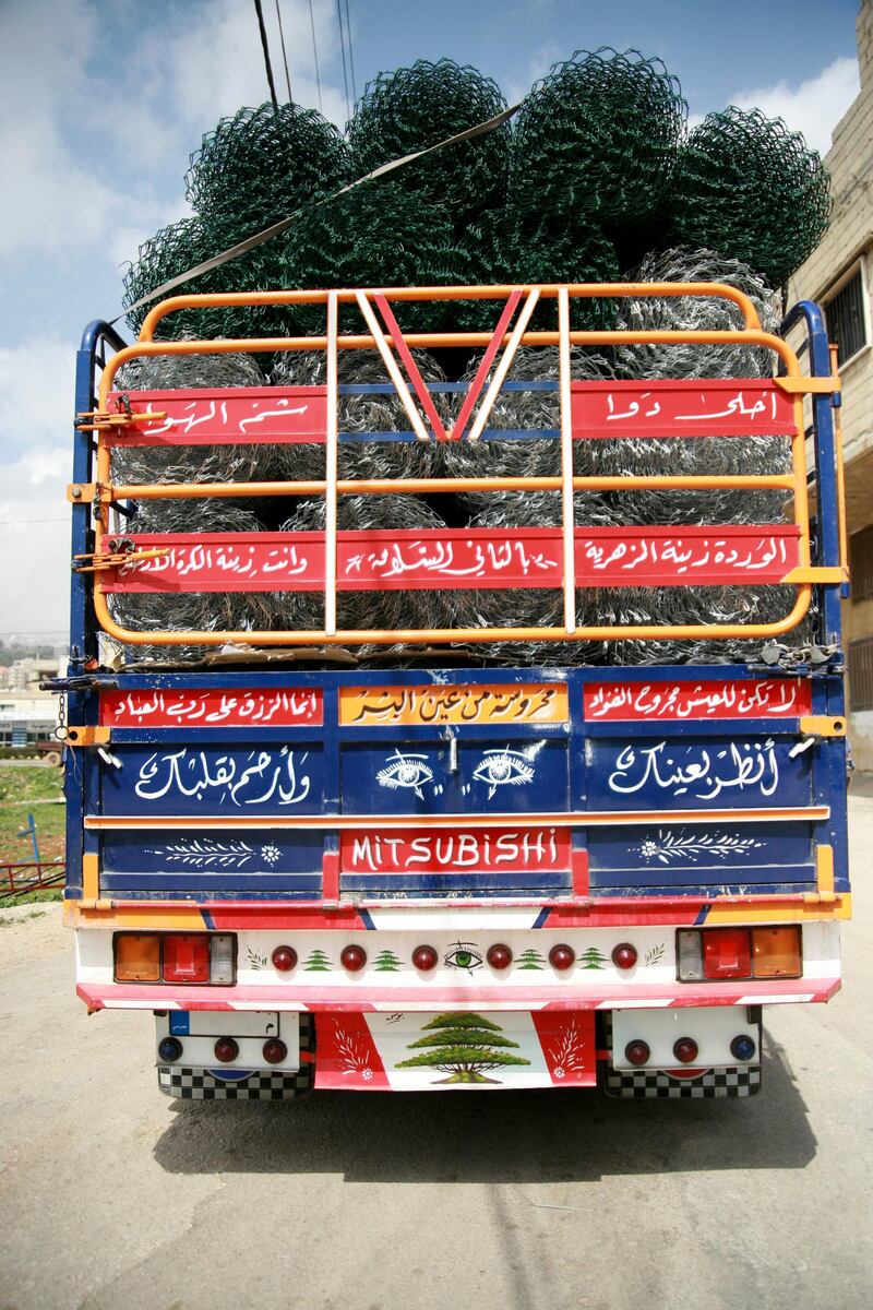Artist Ali Younis has hand-painted hundreds of trucks with designs such as calligraphy. Courtesy Falak Shawwa