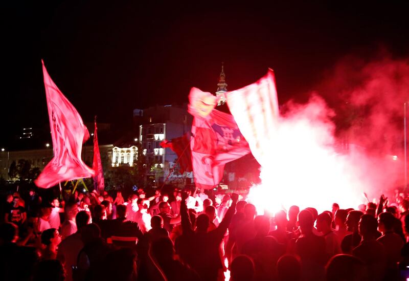 Red Star fans celebrate after their team won the Serbian league title in Belgrade on Saturday. AP
