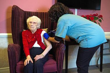 A care home resident receives a Covid-19 vaccine in the UK. Reuters 