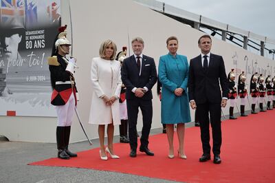 Mette Frederiksen standing beside Emmanuel Macron, who condemned the attack on her. Photo: EPA