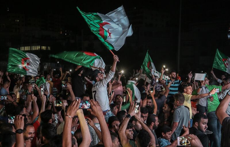 Palestinians supporters of the Algerian soccer team celebrate after the team's victory. EPA