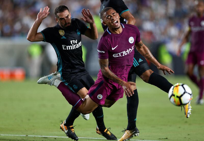 Manchester City's Gabriel Jesus in action with Real Madrid's Dani Carvajal. Lucy Nicholson / Reuters