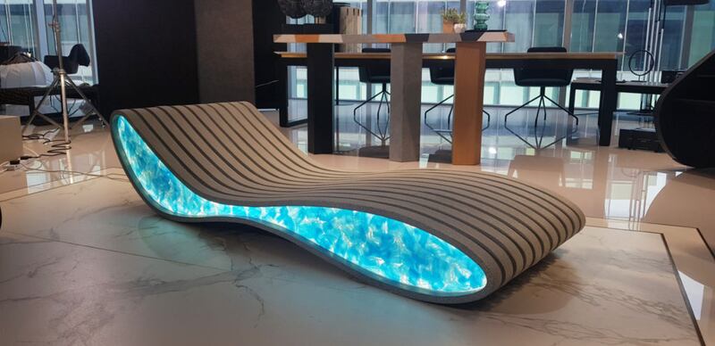One of the art pieces up for auction is called 'Flocean' by Kristina Zanic Consultants. It is a sun lounger comprised of blue face masks to raise awareness of ‘Covid-19-waste’, such as single-use masks and gloves. Photo: Love That Design