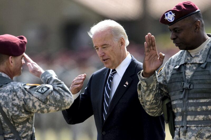 Command Sgt. Maj. Joseph Allen, left, salutes to Vice President Joe Biden and Lt. General Lloyd Austin during a welcome home ceremony for the XVIII Airborne Corps at Fort Bragg, North Carolina Wednesday, April 8, 2009.  (Photo by Takaaki Iwabu/Raleigh News & Observer/Tribune News Service via Getty Images)