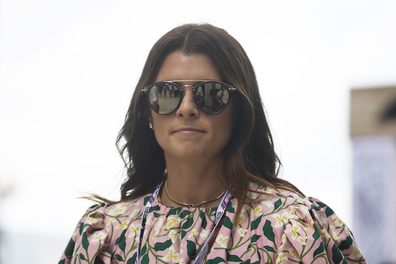 Former race car driver Danica Patrick walks in the paddock prior to the F1 Grand Prix of Miami. AFP

