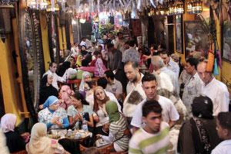 Crowds in the decorated El Fishawy coffee shop, the oldest coffee shop in Egypt built  in 1772, in Cairo.