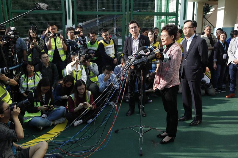 Chief Executive Carrie Lam speaks to media after casting her vote.  EPA