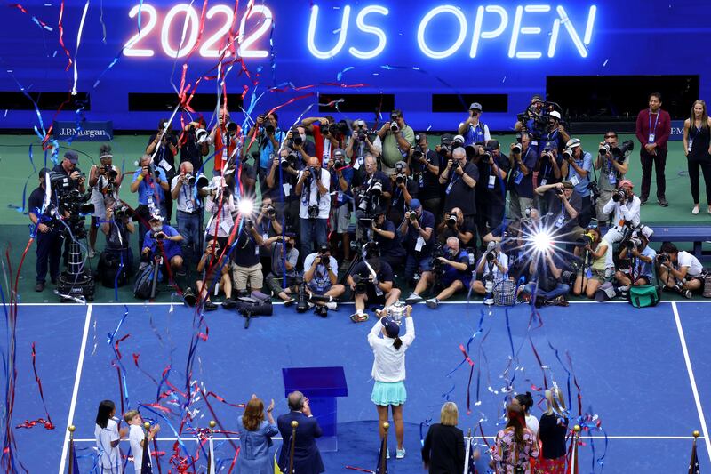 Iga Swiatek celebrates with the championship trophy after defeating Ons Jabeur in the US Open final. Getty