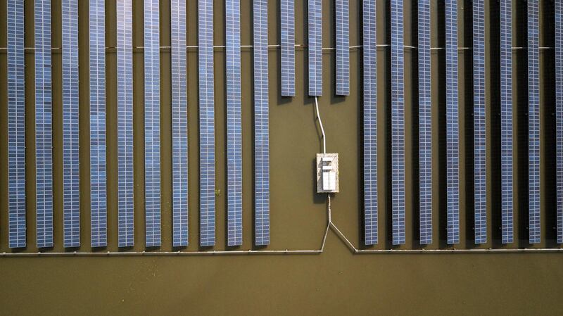 Photovoltaic panels stand at a solar farm in Jiaxing, Zhejiang province, China. Qilai Shen / Bloomberg