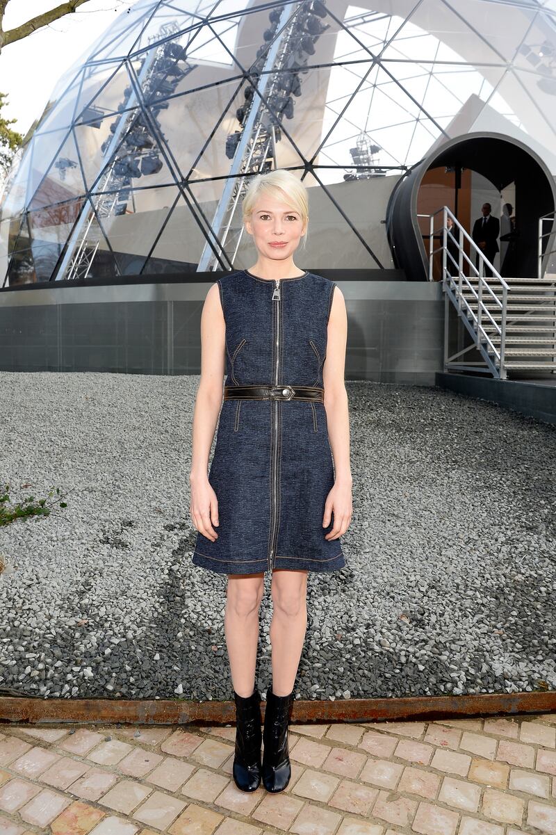 At the Louis Vuitton fall/winter 2015 Paris Fashion Week show on March 11, 2015, Michelle Williams wears a denim dress by the brand, one of her first in a long line of looks from the fashion house. Getty Images