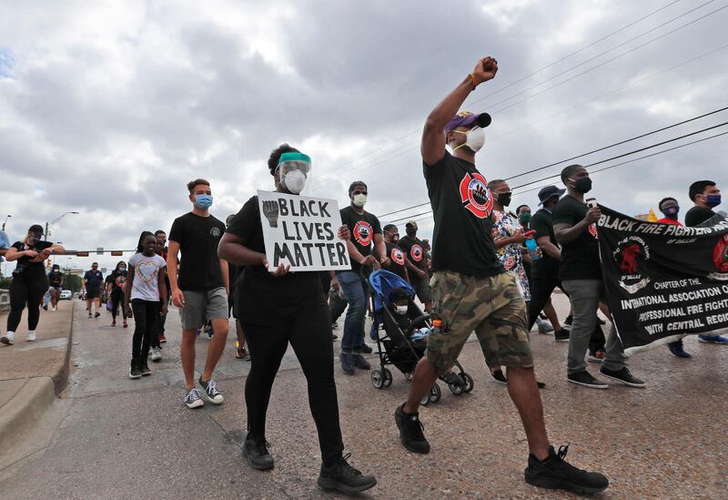 Protesters march in a Juneteenth demonstration organised by the Dallas Black Firefighters Association in Dallas, Friday. AP Photo.