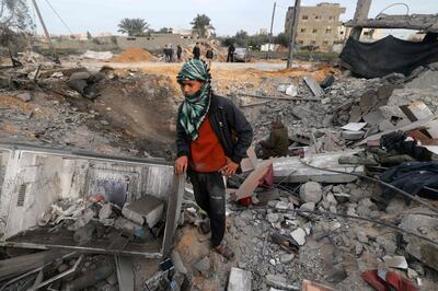 A Palestinian boy surveys a scene of destruction in Rafah, southern Gaza, following overnight Israeli strikes. AFP