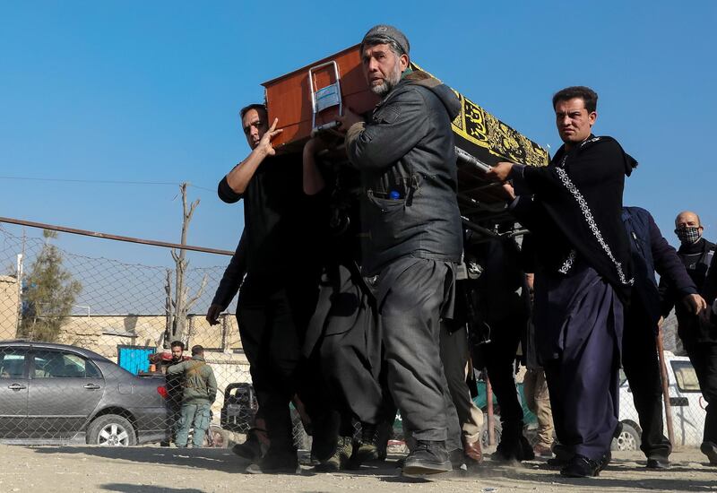 epa08943340 People carry the coffin of an Afghan female judge in Kabul, Afghanistan on 17 January 2021. According to the reports, at least two female judges of the Supreme Court were killed and two other injured, the slain judges were on their way to work in the morning when unknown assailants ambushed and fired on their official vehicle. The latest attack comes two days after the Pentagon announced it cut American troop levels in Afghanistan to 2,500, the lowest in nearly two decades.  EPA/HEDAYATULLAH AMID