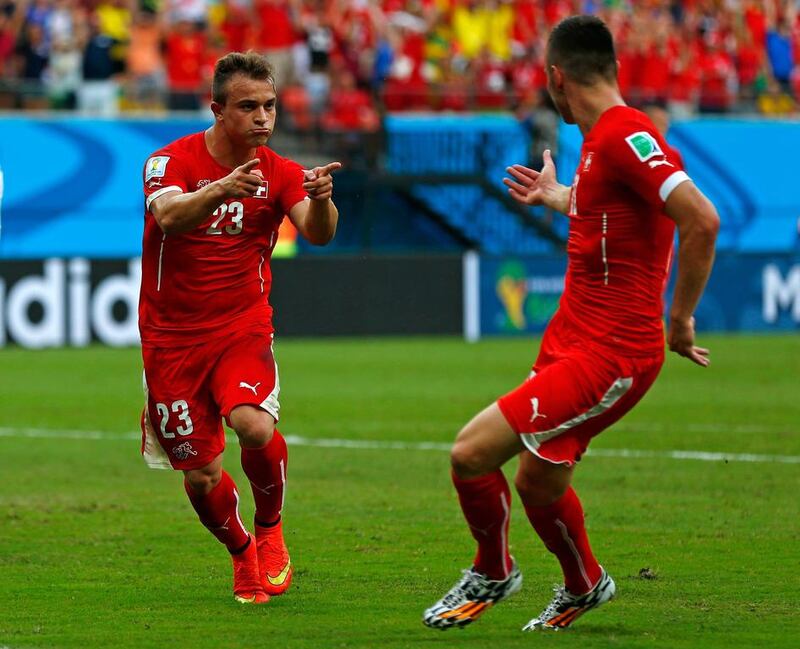 Xherdan Shaqiri celebrates scoring his team's second goal with Josip Drmic of Switzerland during their 3-0 win over Honduras on Wednesday at the 2014 World Cup in Manaus, Brazil. Matthew Lewis / Getty Images