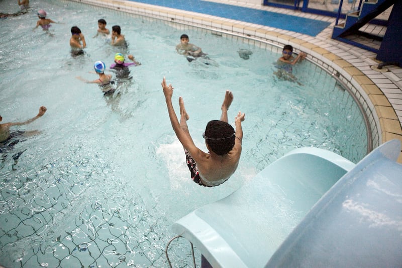 Abu Dhabi, United Arab Emirates, December 31, 2012: 
Children play in the indoor swimming pool at the Armed Forces Officers Club  in Abu Dhabi, on Monday, Dec. 31, 2012.
Silvia Razgova/The National

Note: for a story on the condition of pools in the UAE.