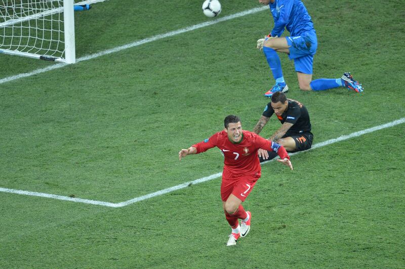 Cristiano Ronaldo celebrates after scoring for Portugal during the Euro 2012 match against the Netherlands  at the Metalist stadium in Kharkiv on June 17, 2012. AFP