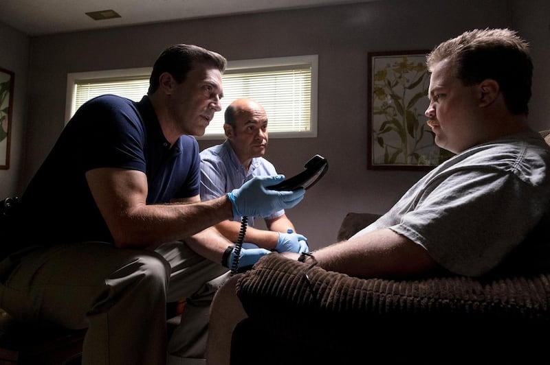 This image released by Warner Bros. Pictures shows Jon Hamm, left, and Paul Walter Hauser in a scene from "Richard Jewell." (Claire Folger/Warner Bros. Pictures via AP)