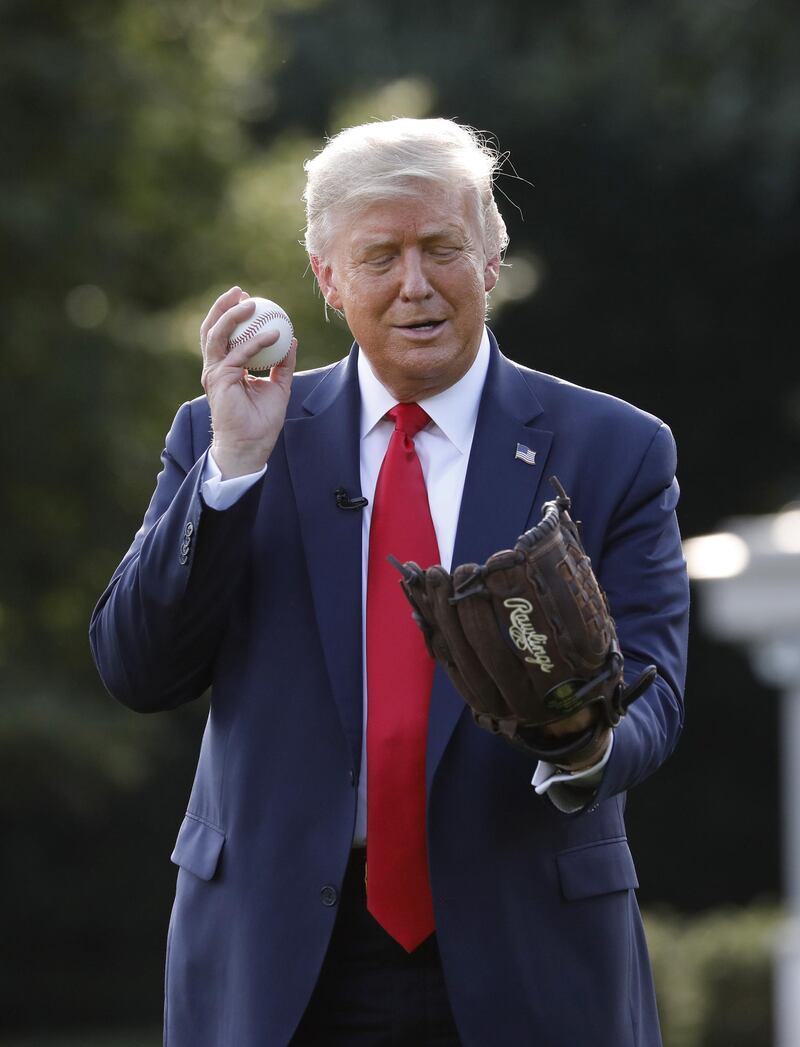 U. President Donald Trump plays catch on the South Lawn of the White House in Washington to celebrate opening day of the MLB season. Bloomberg