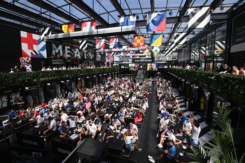 England supporters cheer while watching the England-Croatia match on a big screen  in Boxpark, Croydon. EPA