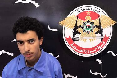 A handout photo made available by Libyan Special Deterrence Forces of the Interior Ministry shows Hashem Abedi, the younger brother of Manchester Arena bomber Salman Abedi, after he was arrested in Tripoli; the 22-year-old has appeared in London court.