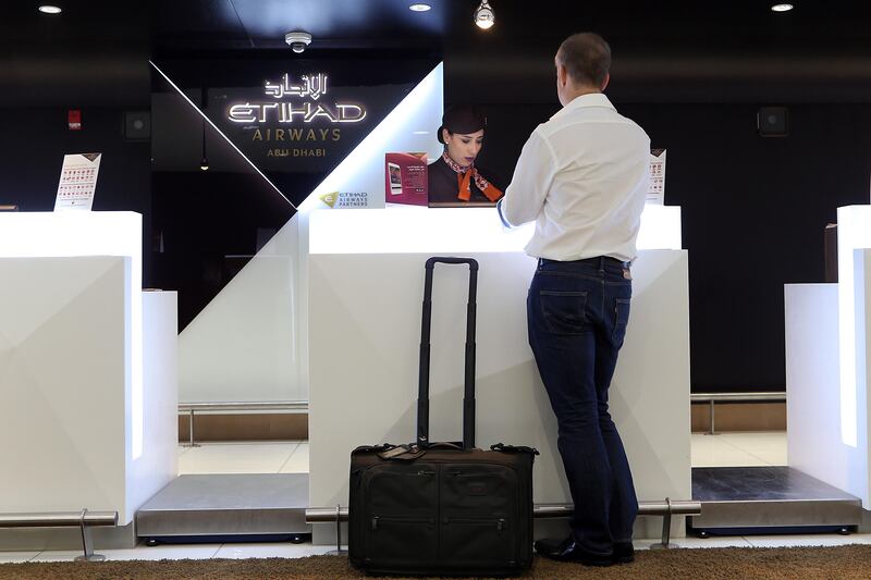 ABU DHABI, UNITED ARAB EMIRATES - - -  June 1, 2016 --- A passenger checks-in at the Etihad Airways Business Class guest counter at Abu Dhabi International Airport on Wednesday, June 1, 2016.     ( DELORES JOHNSON / The National )  
ID: 78835
Reporter:  none
Section: BZ *** Local Caption ***  DJ-010616-BZ-STOCK-Etihad-78835-011.jpg DJ-010616-BZ-STOCK-Etihad-78835-011.jpgDJ-010616-BZ-STOCK-Etihad-78835-011.jpg