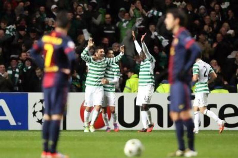 Tony Watts, third from right, scored the matchwinner in Celtic Glasgow's 2-1 shock win over Barcelona in the Champions League. Scott Heppell / AP Photo