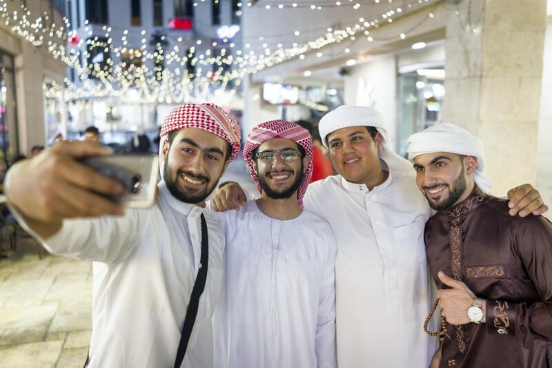 Selfie of cheerful group of people