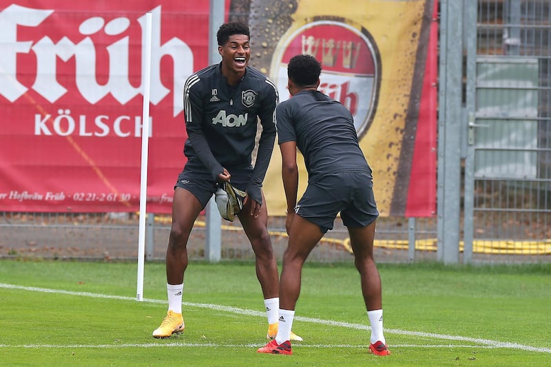 COLOGNE, GERMANY - AUGUST 15:  Marcus Rashford of Manchester United laughs during a training session at RheinEnergieStadion on August 15, 2020 in Cologne, Germany. (Photo by Matthew Peters/Manchester United via Getty Images)