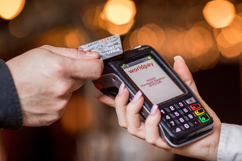 Cards can easily be cloned when handed over to a merchant in a store to make a point-of-sale payment. Getty Images